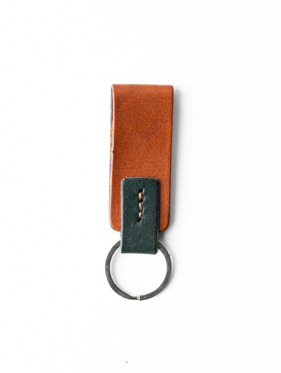Brown leather key fob with a silver ring on a white background