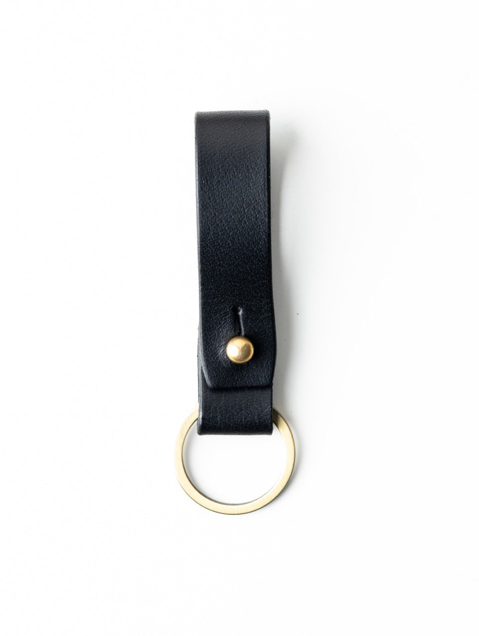 Black leather key fob with gold accent on a white background